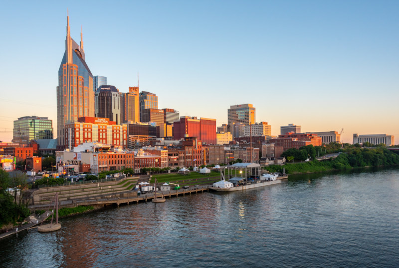 River Amidst Buildings Against Sky During Sunset in Nashville Tennessee