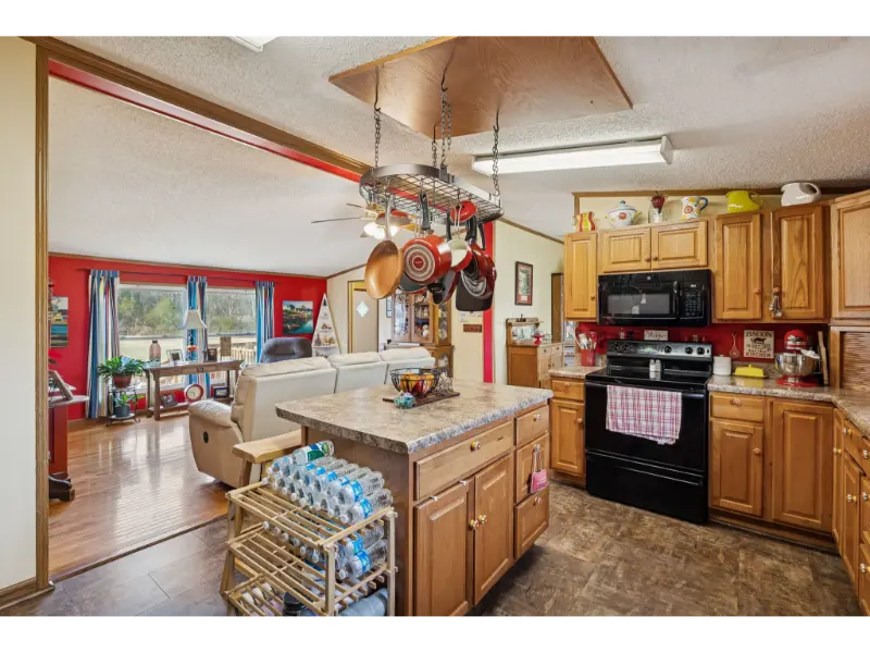 Open concept kitchen overlooking a living area